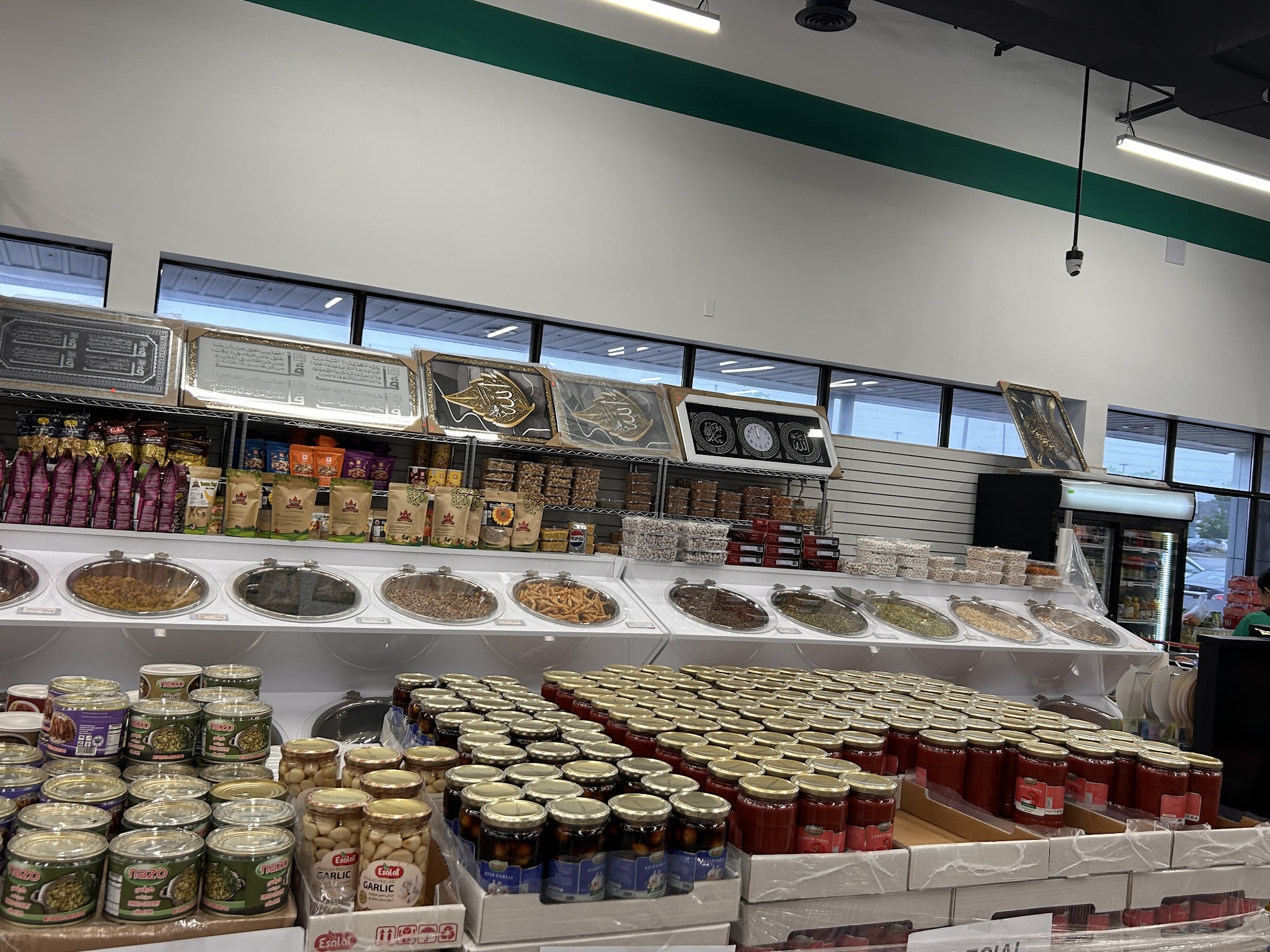 Jars of preserves, pickles, and dried goods display