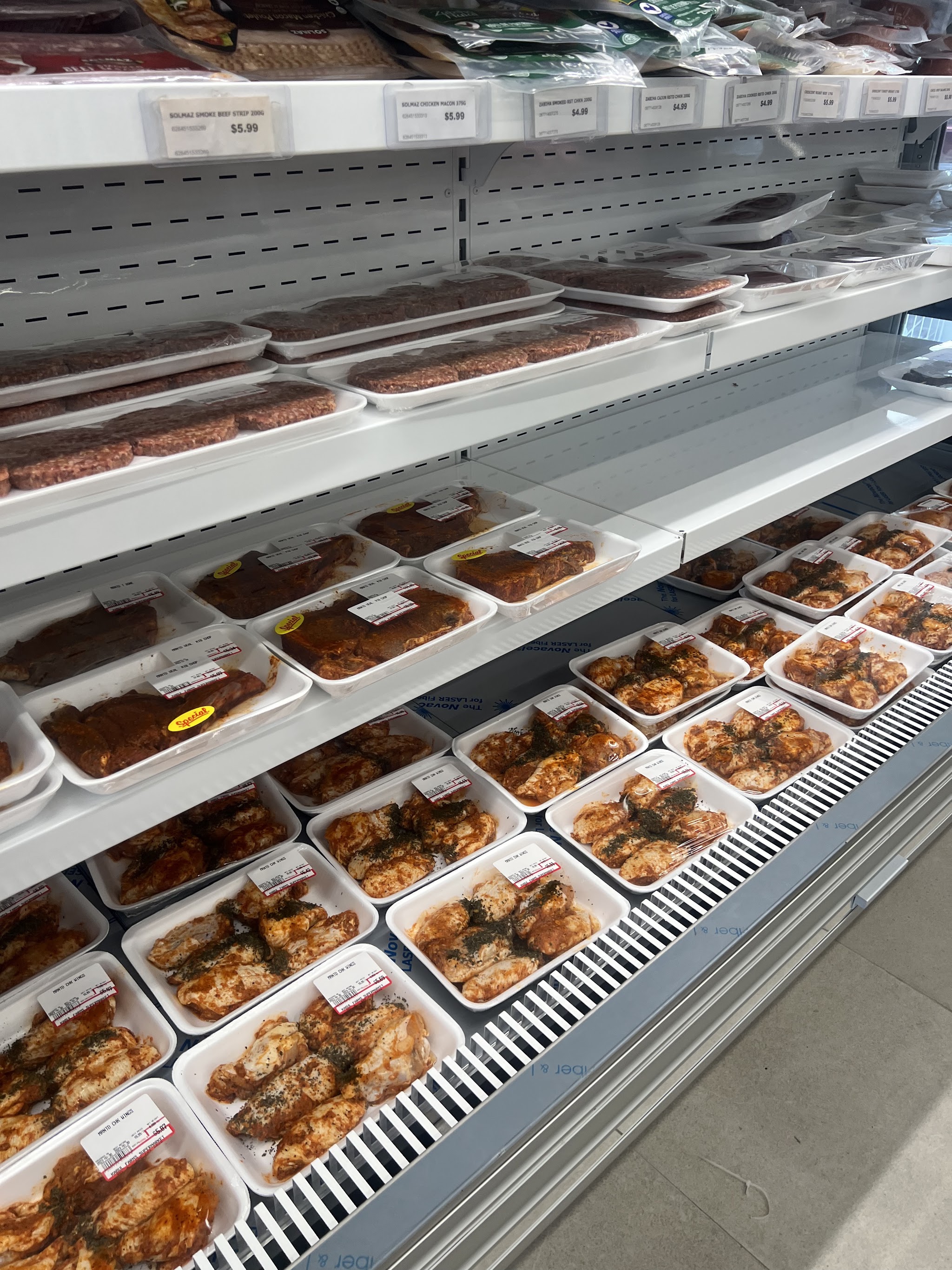 Marinated meats and prepared foods at the deli counter